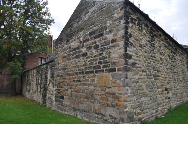 Section of wall bounding All Saints Church Yard on South